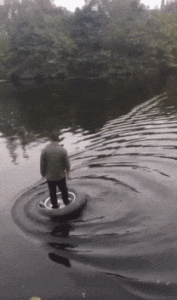 a man sailed through water on a truck tire