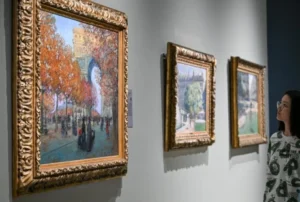 A girl is watching a french painting in China